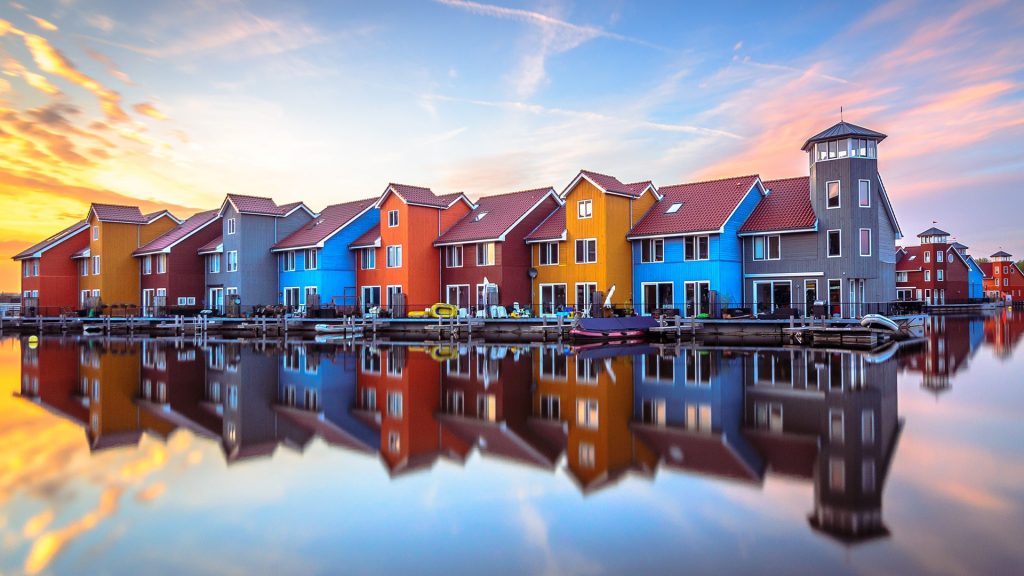 Colorful wooden houses by a lake, Reitdiephaven, Groningen, Netherlands