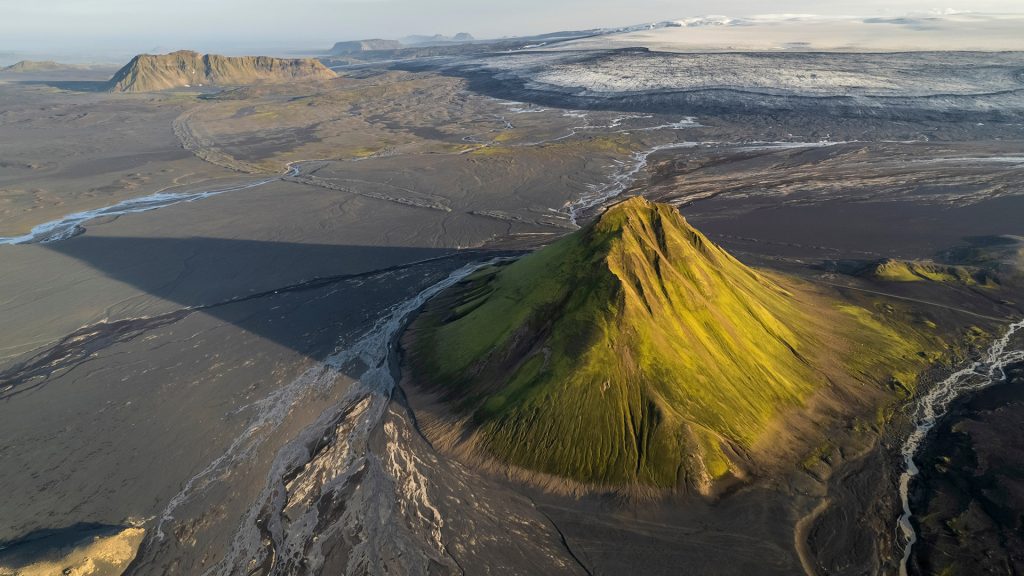 Aerial view of Maelifell mountain at sunset with valley landscape, Iceland