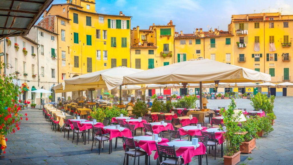 A cozy morning cafe on the square of the old town, Piazza dell'Anfiteatro, Lucca, Italy