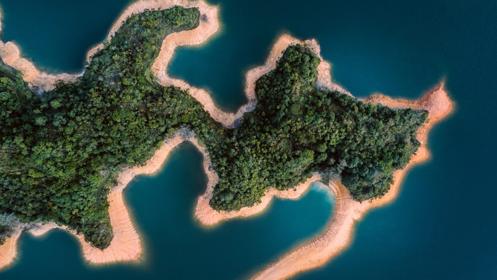 Aerial shot of unique shaped island with a forest, Hong Kong