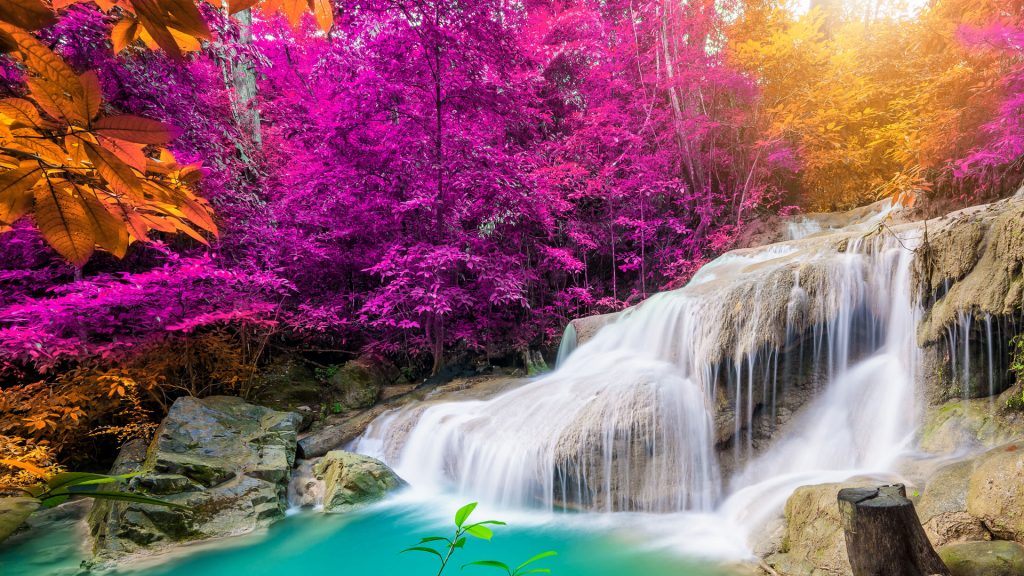 Waterfall in tropical forest with autumn colors at Erawan waterfall National Park, Thailand