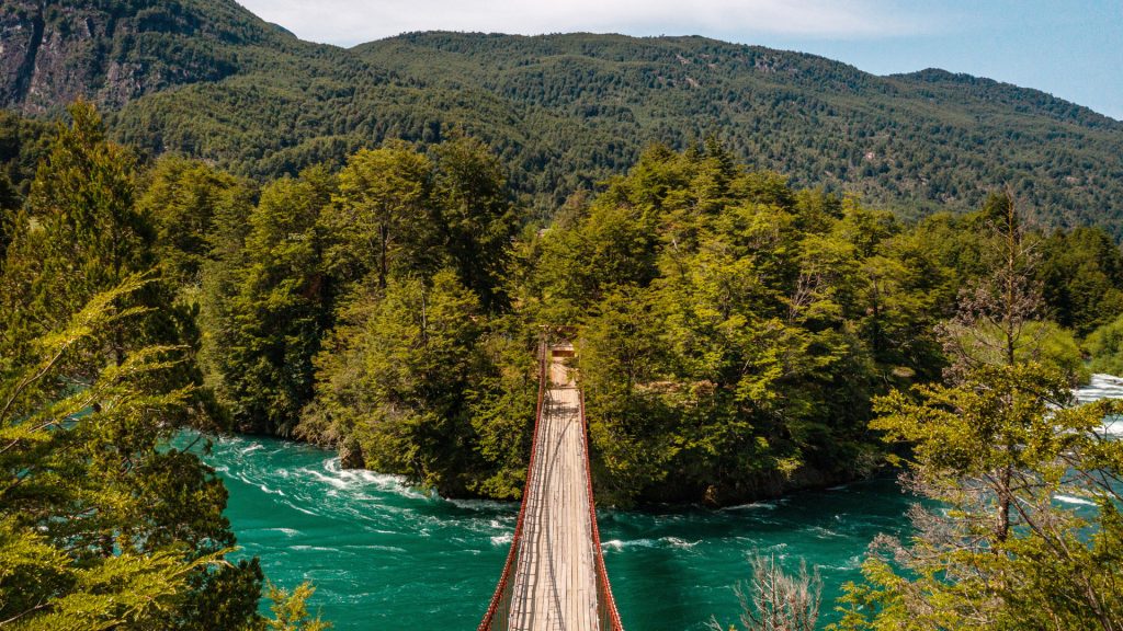Suspension bridge in the middle of the mountains and Futaleufu River, Patagonia, Chile