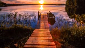 Laminated Sunset Over The Fishing Pier at Finland Lake Photo
