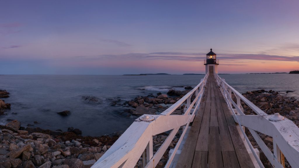 Marshall Point Lighthouse panorama at autumn sunset, Port Clyde Harbor, Maine, USA