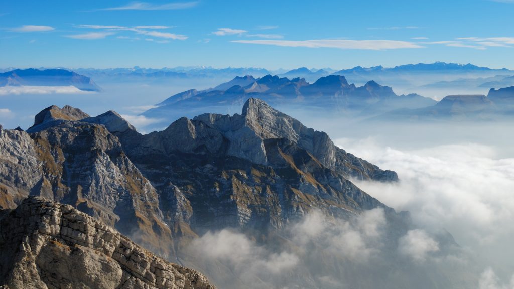View over clouds from top of Säntis mountain, Alpstein massif, Switzerland