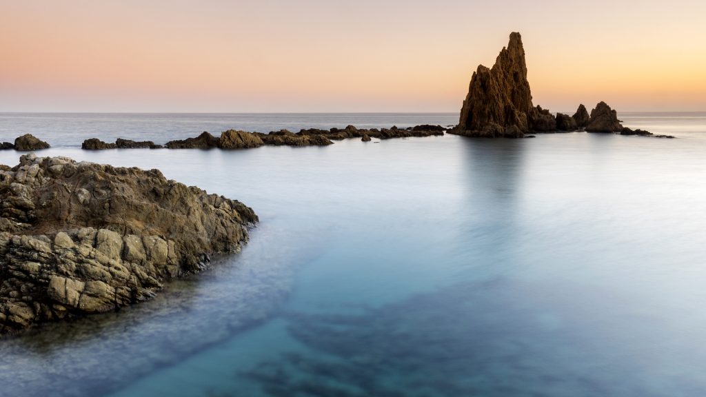 Sunset on the beach and rocky coast of the Cabo de Gata, Níjar Natural Park, Almeria, Spain