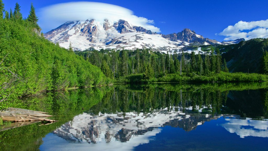 Reflection of lenticular clouds over Mount Rainier near Seattle, Washington State, USA