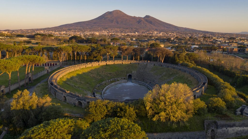 Vesuvius volcano and the Amphitheater of Pompeii archaeological site, Naples, Campania, Italy