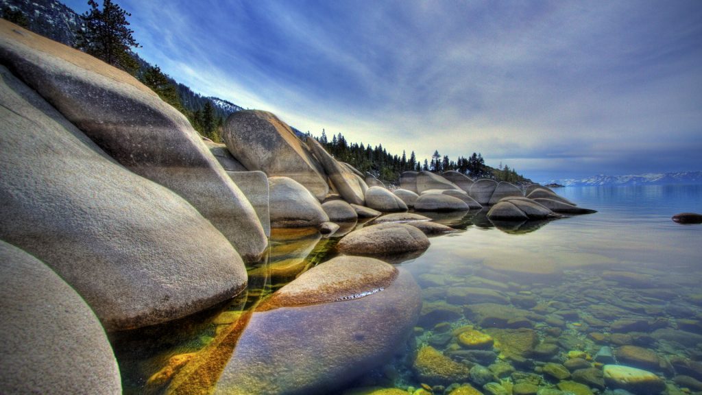 Scenic morning landscape of Lake Tahoe shore with clear waters, Nevada, USA