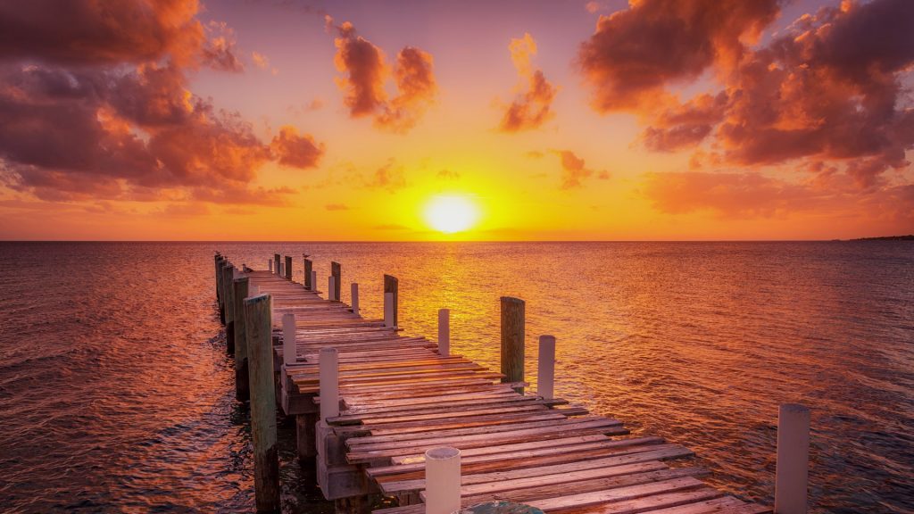 Boat and fishing dock during caribbean sunset, Eleuthera island, Bahamas