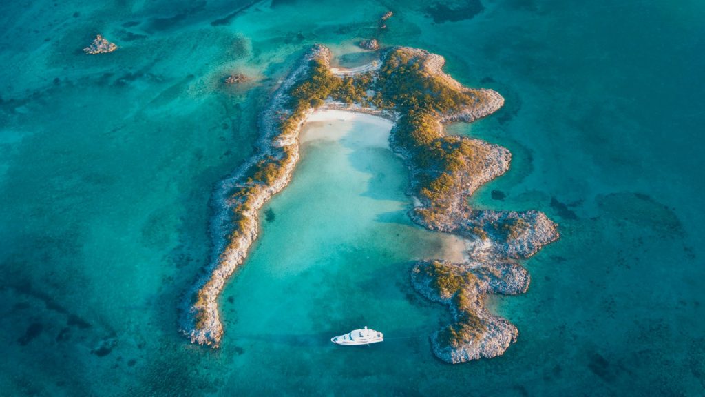 Yacht anchored of a tropical island in the Caribbean Sea, Bahamas