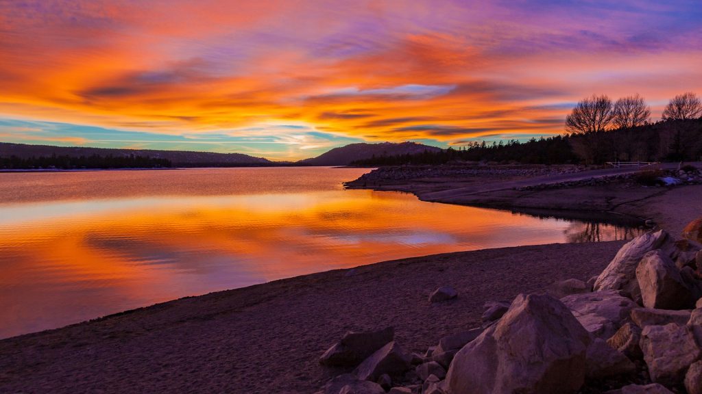 Big Bear Lake sunset with reflections and cloudscape, San Bernardino, California, USA