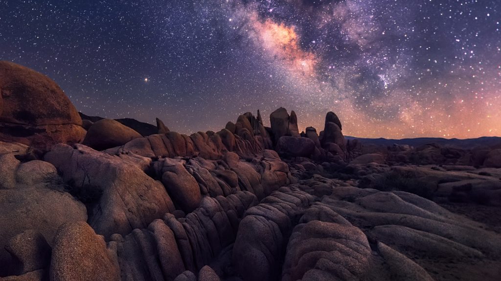 Milky Way over the rugged and rocky terrain of Joshua Tree national park, Arizona, USA