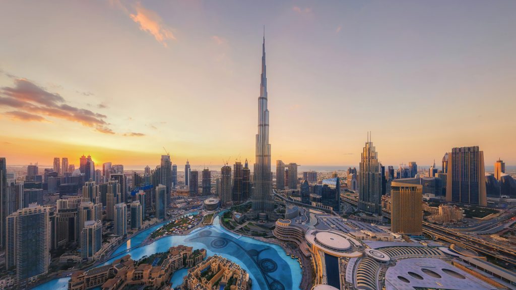 Aerial view of Burj Khalifa, downtown skyline and fountain at sunset, Dubai, UAE