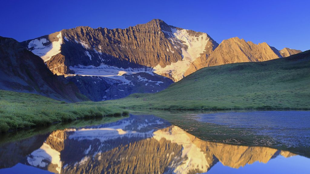 La Grande Casse reflects at dawn in the Lac du Grand Plan, Vanoise National Park, France