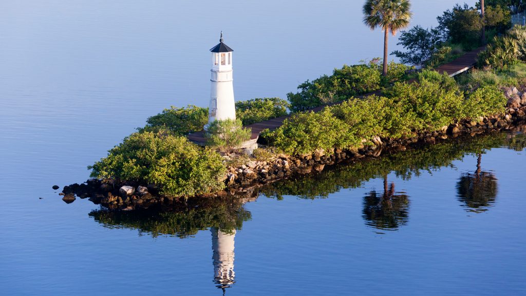 The morning view of Tampa city lighthouse with reflection in Hillsborough Bay, Florida, USA