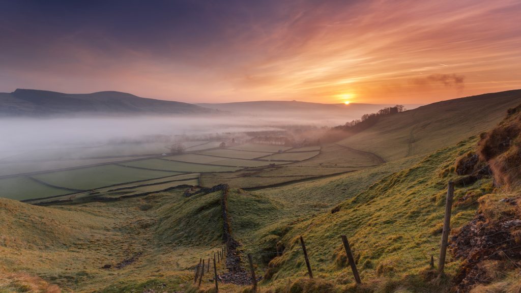 Hope valley sunrise with Castleton Fort and village, Peak District National park, England, UK