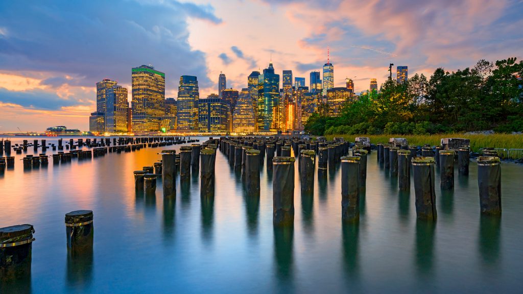 Downtown skyline seen from Brooklyn Bridge Park at dusk, New York City, USA