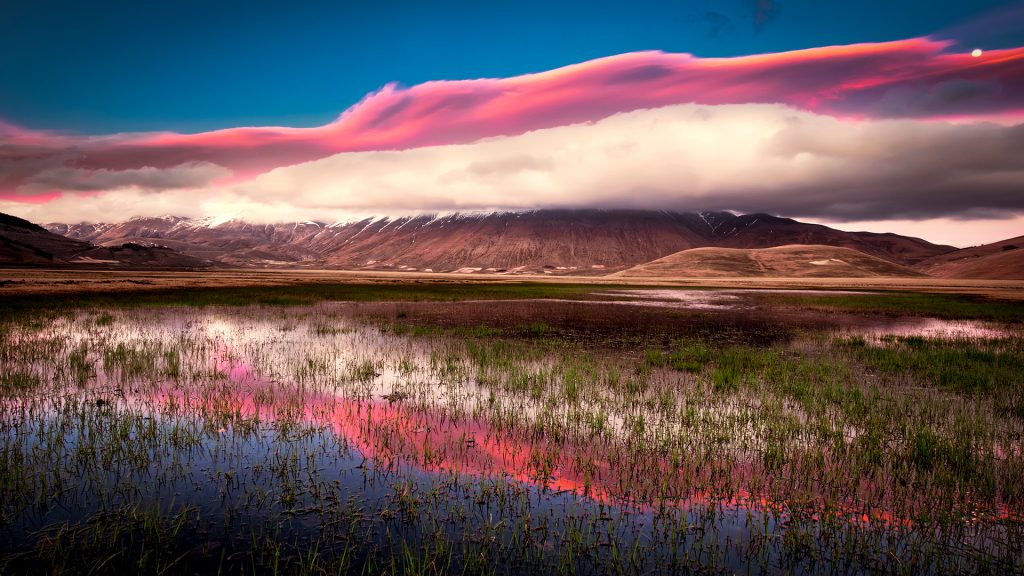 Sunset on Castelluccio di Norcia plain, Monti Sibillini National Park, Perugia, Umbria, Italy