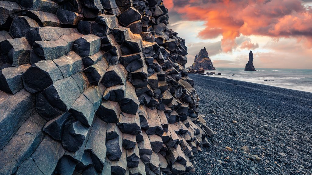 Sunset at Reynisdrangar basalt sea stacks cliffs near Vík in summer, Reynisfjall, Iceland