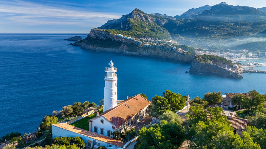 Far des Cap Gros lighthouse above the Port de Sóller bay in spring, Mallorca, Balearic, Spain