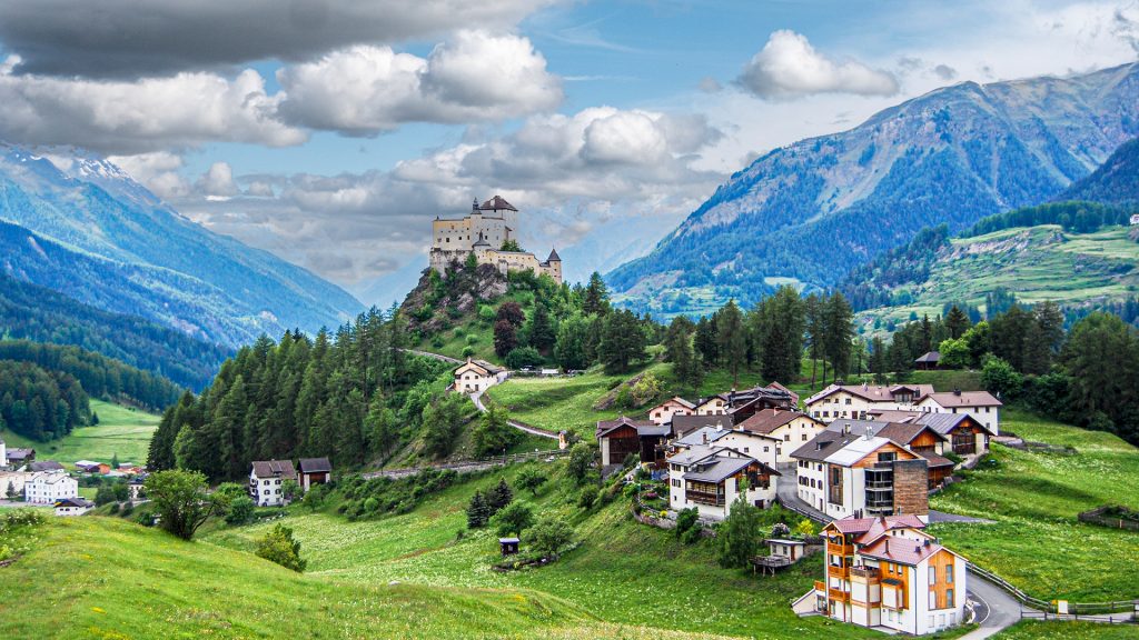 Tarasp Castle on a conical rocky hill in Scuol, Lower Engadin, Graubünden, Switzerland