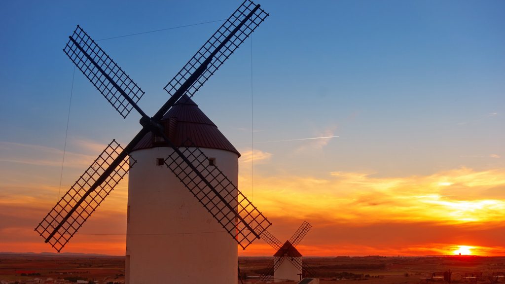 Sunset over Mota del Cuervo windmills in Cuenca at Castile la Mancha of Spain