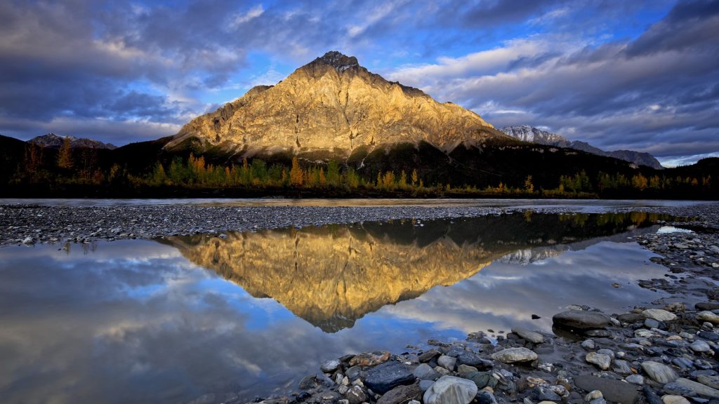 Mountain reflected in lake water in autumn evening, Brooks Range, Alaska, USA