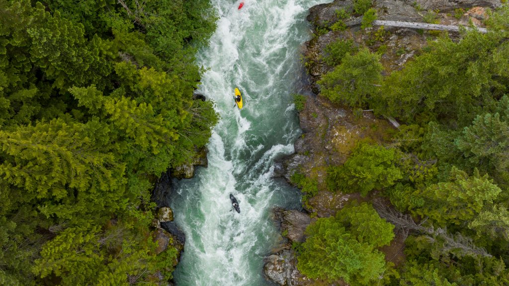Paddlers making their way down the rough Cheakamus River, Whistler, British Columbia, Canada