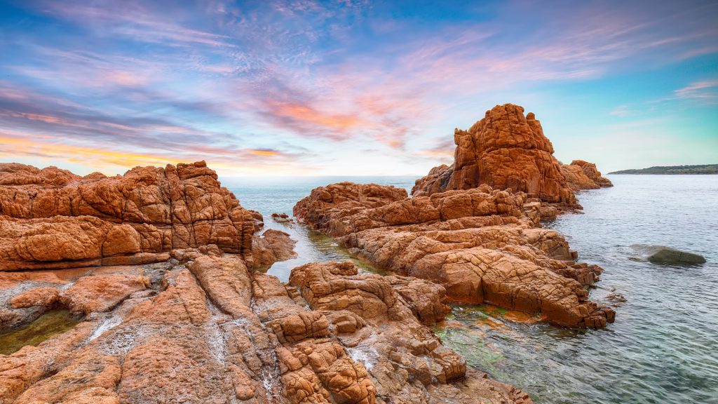 Red rocks at Spiaggia Is Scoglius Arrubius beach in Cea, Tortoli, Ogliastra, Sardinia, Italy