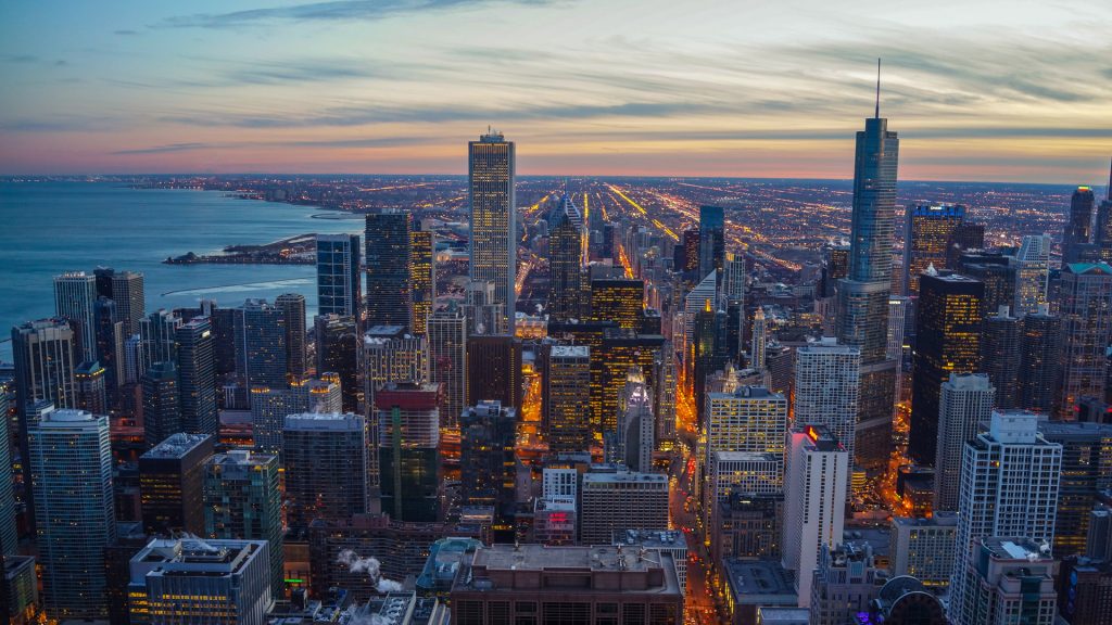 Chicago city skyline twilight sunset with Lake Michigan, Illinois, USA