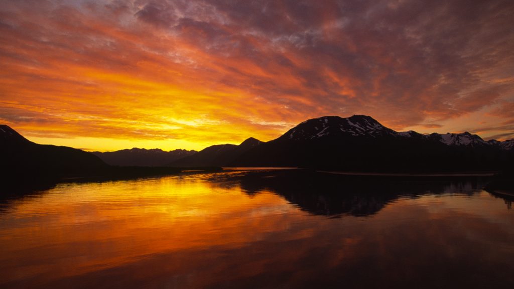 Sunset over the Kenai Peninsula reflected in Turnagain Arm, Alaska, USA