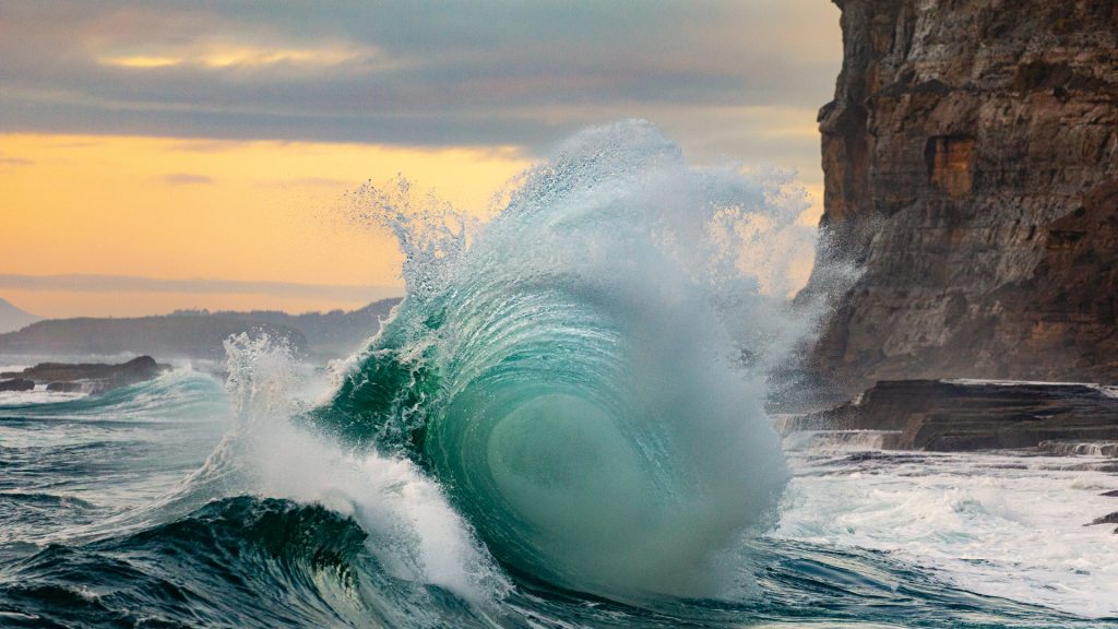 Colliding waves in Murramarang National Park at sunrise, New South Wales, Australia
