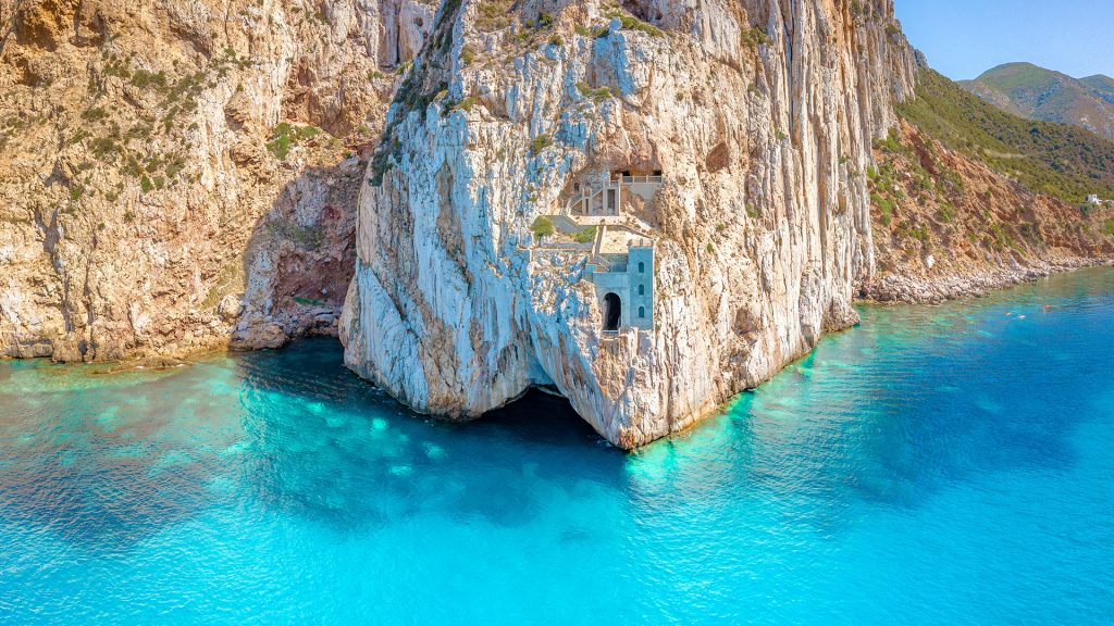 Cave on the sea bay and turquoise water, Porto Flavia harbor, Iglesias, Sardinia, Italy