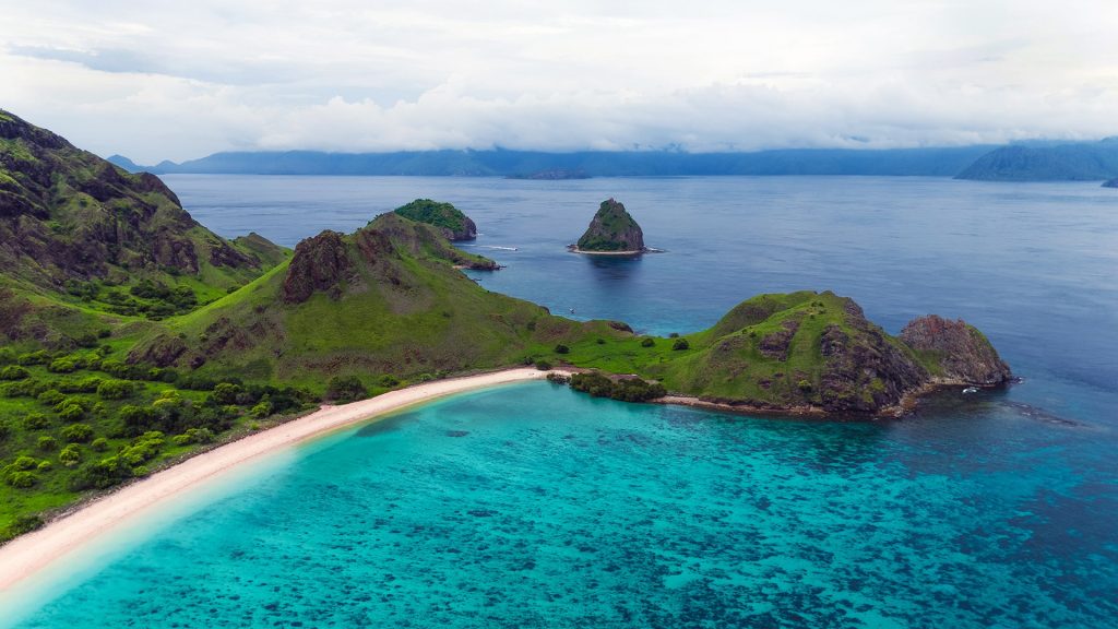 Aerial view of island with pink beach in Komodo National park, East Nusa Tenggara, Indonesia