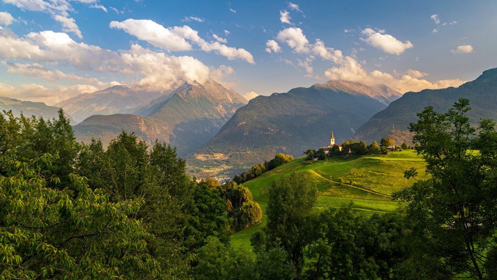 Summer sunset between the clouds in the mountains of Valle d'Aosta valley, Italy Summer sunset between the clouds in the mountains of Valle d'Aosta valley, Italy