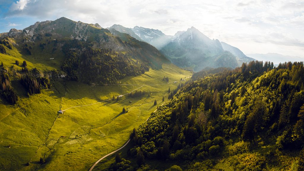 Valley surrounded by mountains at Laui, Wildhaus, Toggenburg, St. Gallen, Switzerland Valley surrounded by mountains at Laui, Wildhaus, Toggenburg, St. Gallen, Switzerland