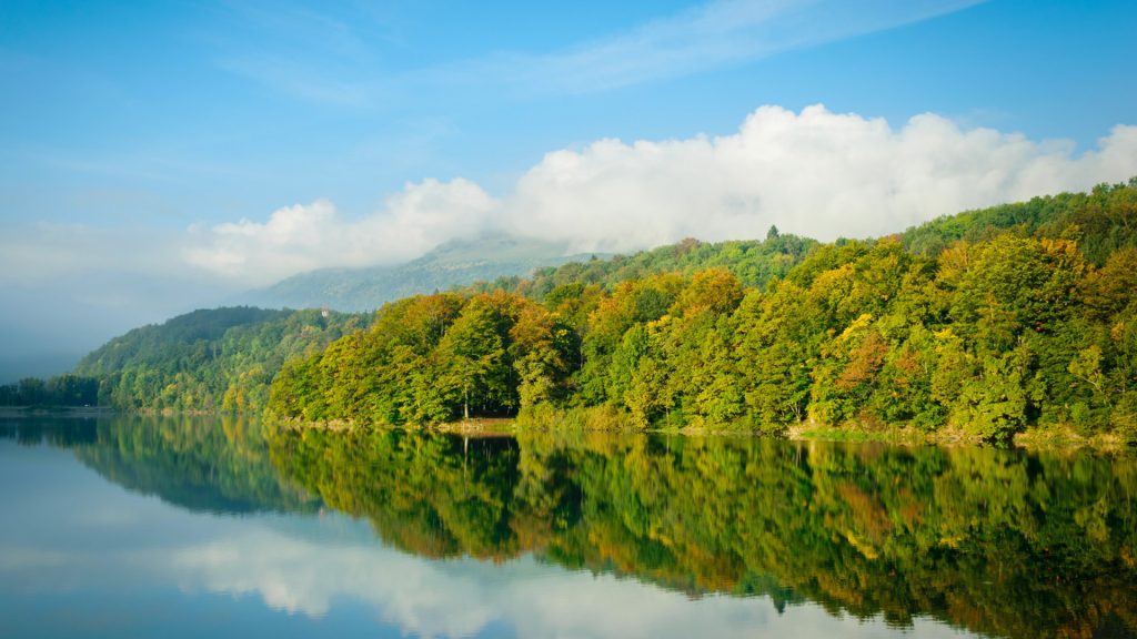 Misty morning and sunrise on the lake Laffrey, Grenoble, France Misty morning and sunrise on the lake Laffrey, Grenoble, France