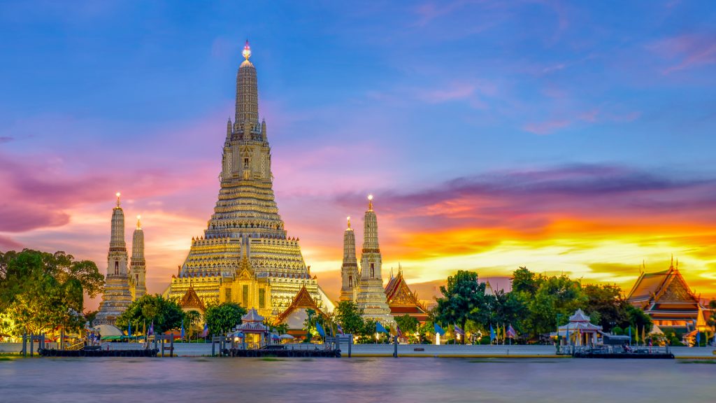 Sunset city skyline at Wat Arun temple and Chao Phraya River, Bangkok, Thailand