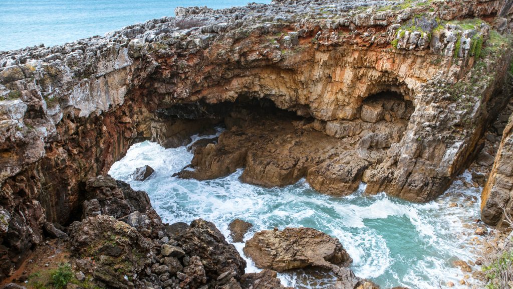 Boca do Inferno (Hell's Mouth) sea cave and natural rock arch on coast of Cascais, Portugal Boca do Inferno (Hell's Mouth) sea cave and natural rock arch on coast of Cascais, Portugal