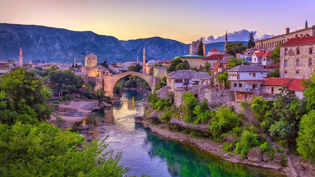Neretva river winding through Mostar, Stari Most bridge summer view, Bosnia and Herzegovina
